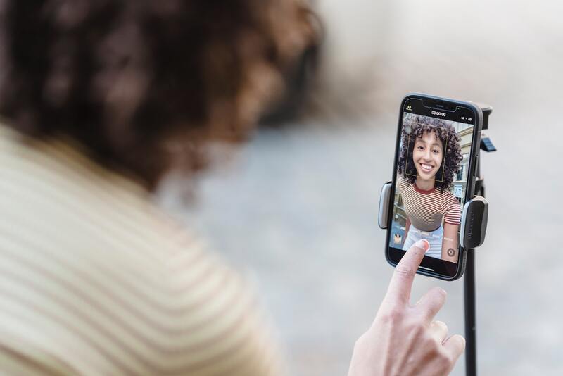 woman filming video for tiktok