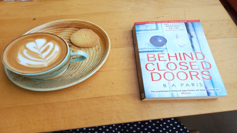 Book Behind Closed Doors and coffe on table