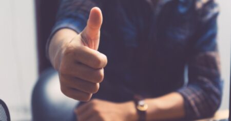 Businessman Holding Thumb Up