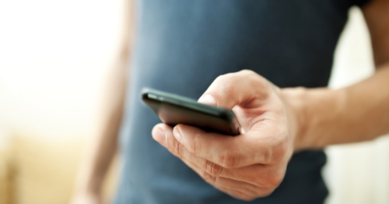 Man Holding a Smartphone